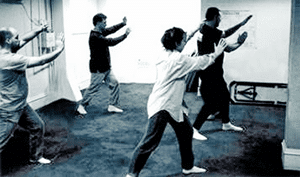 Picture of four people doing Tai Ji.